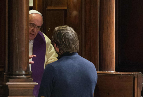 Pope Francis hears confession from a man during a penitential liturgy in St. Peter's Basilica at the Vatican March 28. Pope Francis surprised his liturgical adviser by going to confession during the service. (CNS photo/L'Osservatore Romano via Reuters) (March 31, 2014) See POPE-PENANCE March 28, 2014.