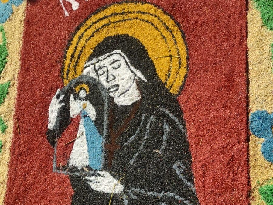 Corpus Christi: tapete com a capa do livro de Santa Faustina